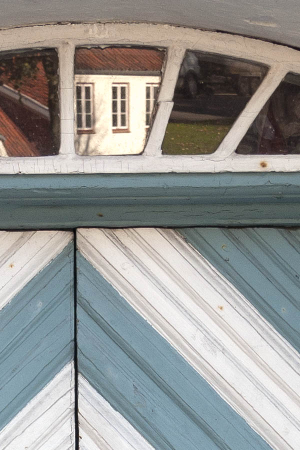 Photo 09309: Worn, white and light blue double door with diamond-shaped boards and fan light