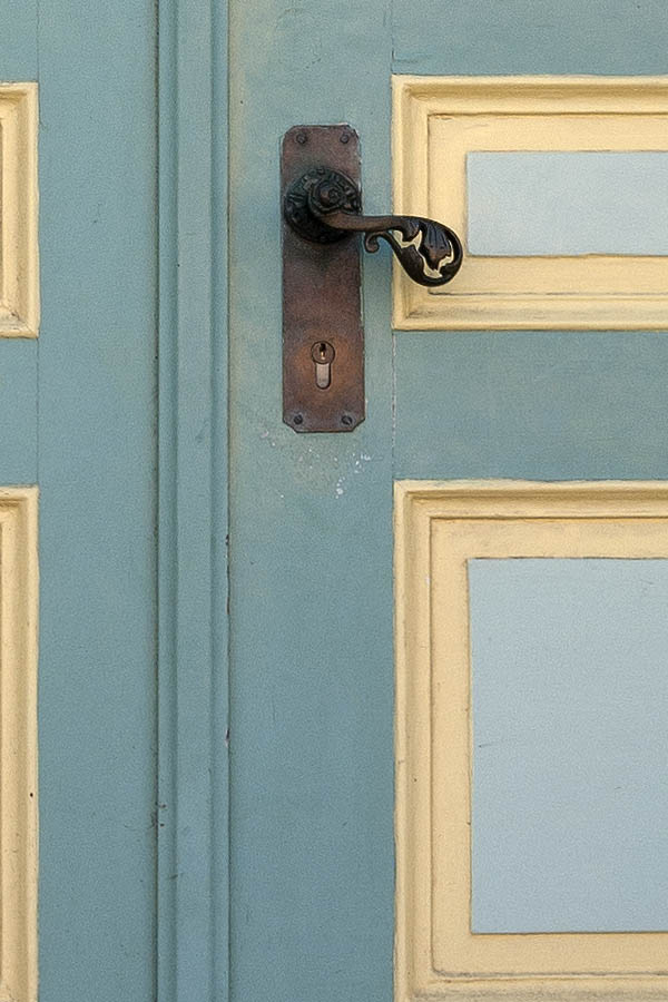 Photo 09357: Panelled, green, yellow and light grey double door with fan light and banisters