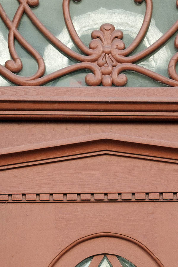 Photo 09467: Carved, panelled, brown door with fan light and door light