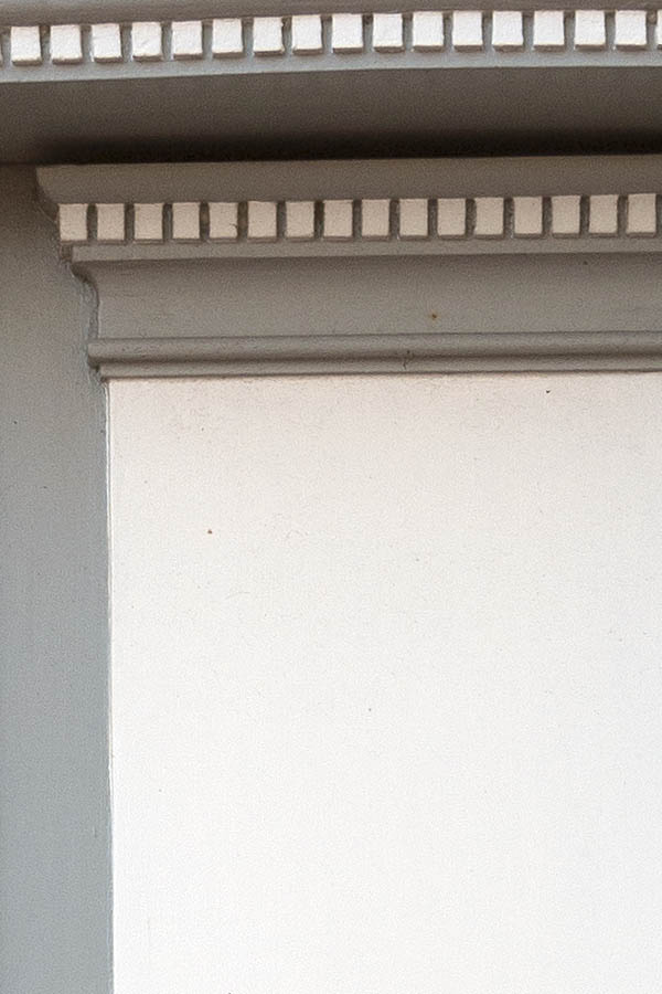 Photo 09556: Carved, panelled, grey and white double door with top window