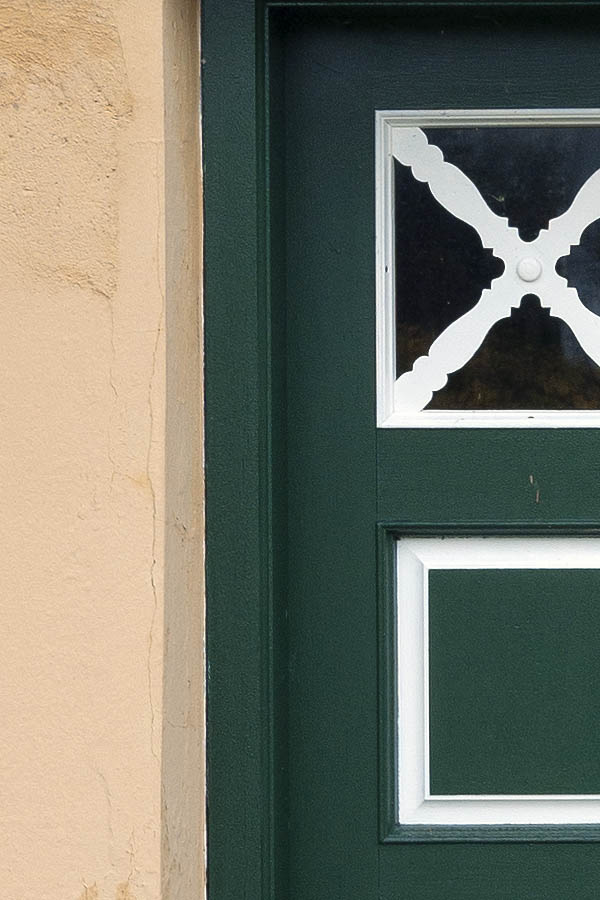 Photo 09699: Worn, panelled, green and white double door with door lights