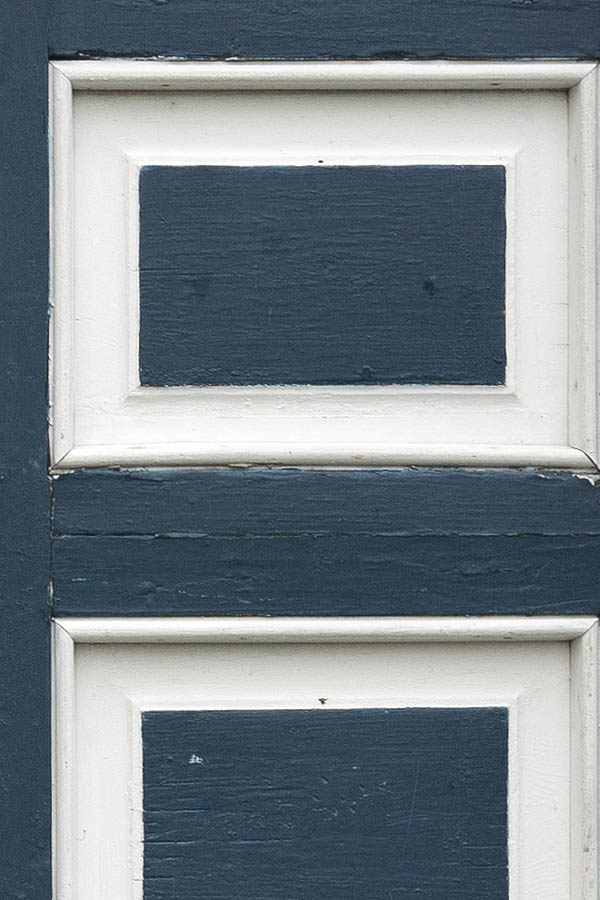Photo 09706: Worn, panelled, blue and white double door with door lights