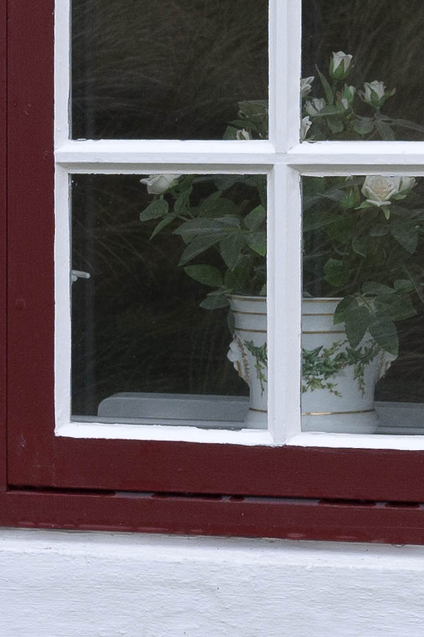 Photo 09760: Red and white window with three frames and 18 panes