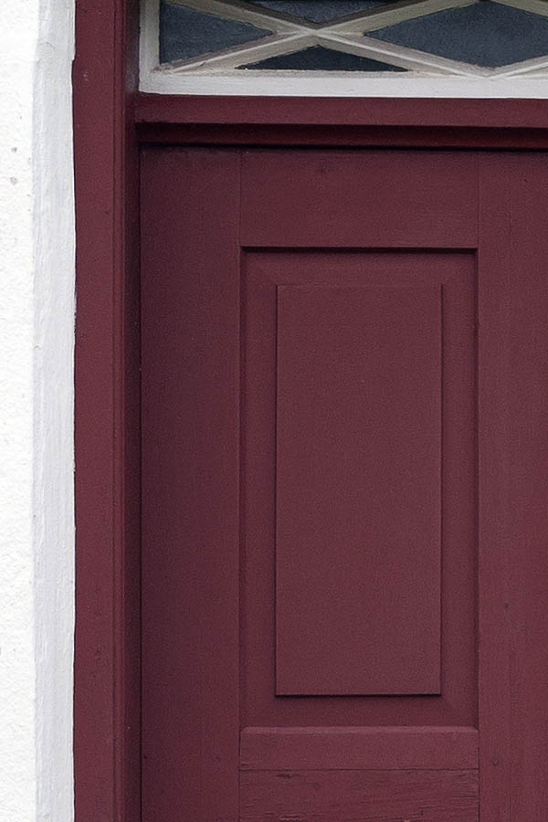 Photo 09830: Carved, panelled, red and white double door with top window