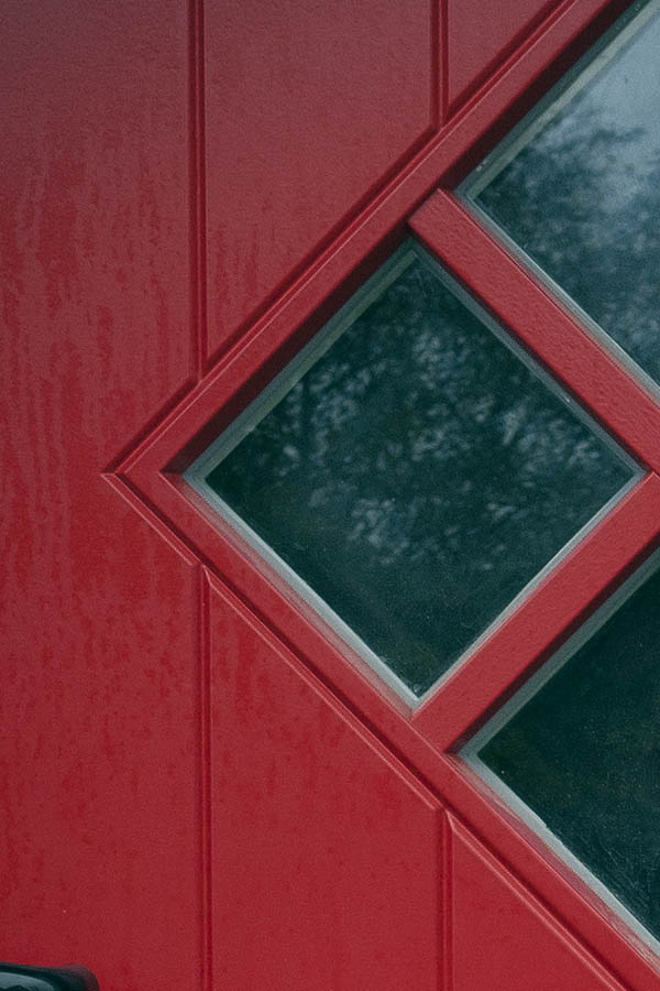 Photo 09859: Crimson red half-door made of planks with a diamond-shaped door light