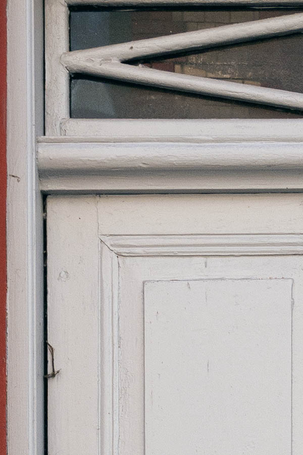 Photo 10097: Carved, panelled, white double door with top window