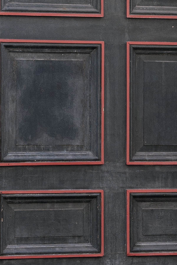 Photo 10341: Lopsided, formed, panelled, black and red gate with top window