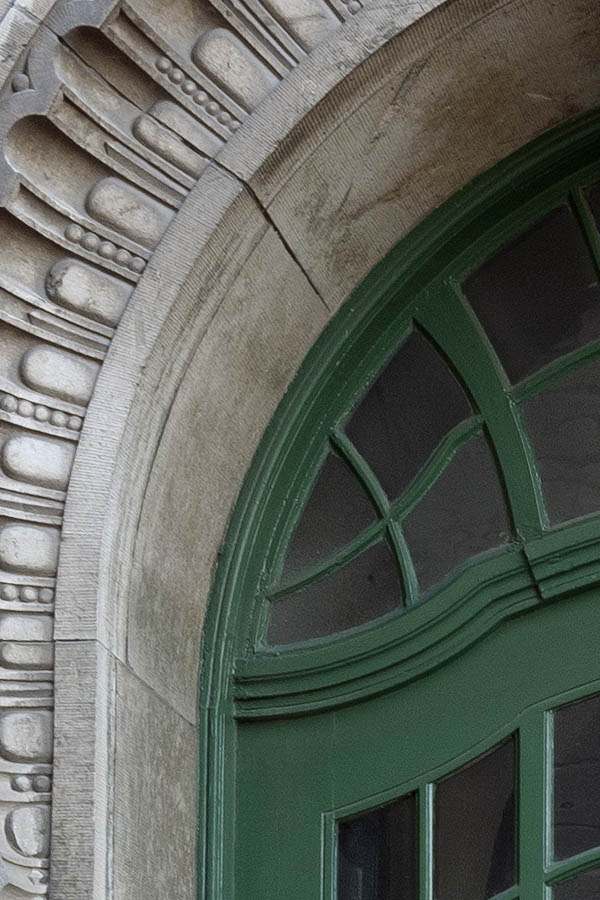 Photo 10354: Formed, carved, green double door with fan light and an excessively decorated marble pilaster