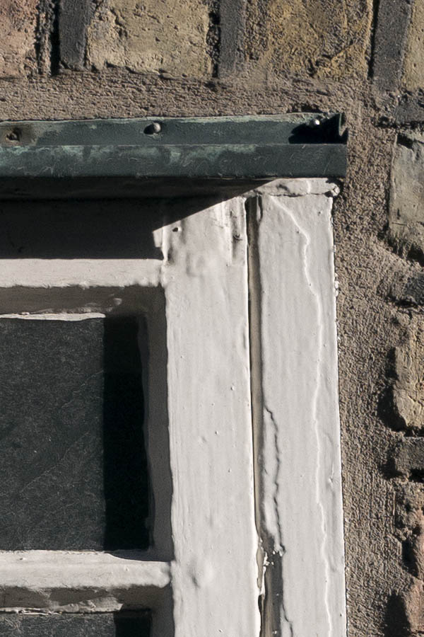 Photo 10394: Tiny, white window with four panes