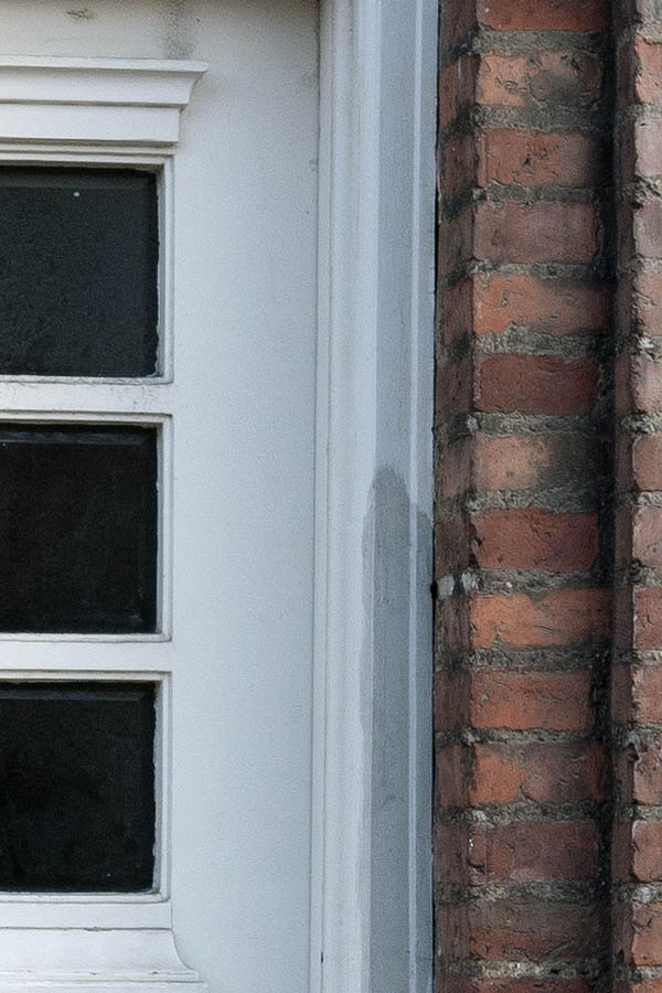 Photo 10519: Worn, panelled, white door with fan light and door light