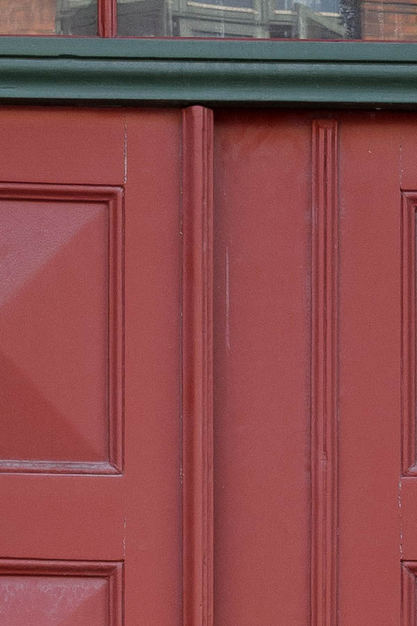 Photo 10796: Panelled, red double door with top window