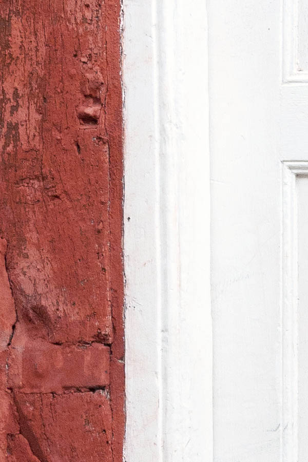 Photo 10839: Worn, panelled, white double door with top window