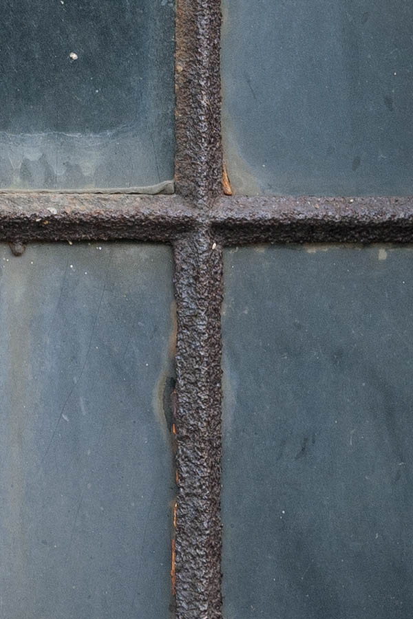 Photo 10946: Formed, brown, rusty, metal stable window