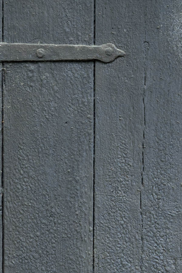 Photo 11089: Worn, black door made of planks