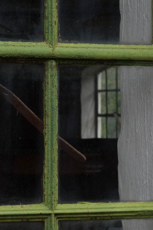 Photo 11135: Formed, green metal window with 16 panes