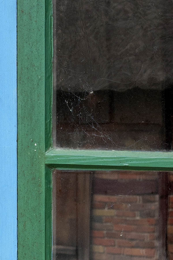 Photo 11191: Blue and green window with two frames and 12 panes