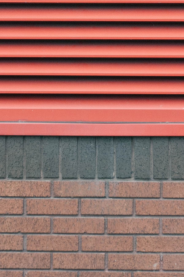 Photo 11404: Large, red window with ventilation grating