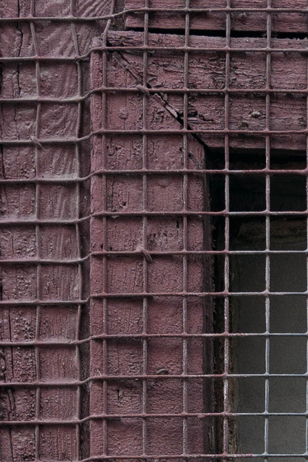 Photo 11759: Worn, brown, latticed window with two panes