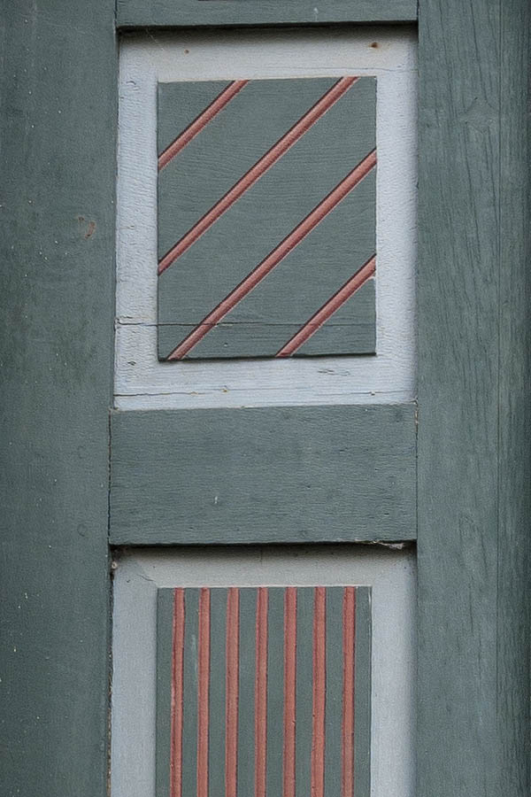 Photo 11855: Lopsided, decayed, panelled, green, red, grey and white double door with top window