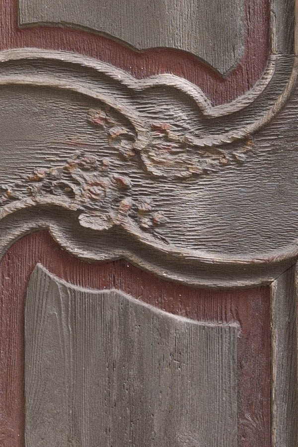 Photo 11995: Worn, carved, panelled, brown, yellow and red double door with formed door lights