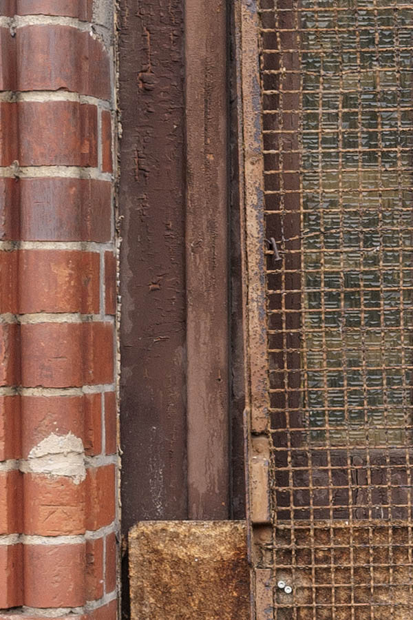 Photo 12158: Decayed, panelled, brown door with sidepiece and rusty lattice