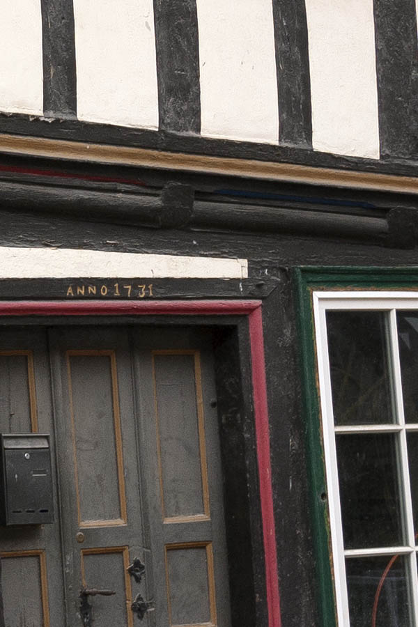 Photo 12288: Lopsided facade with eight white and blue windows and black and white half-timber