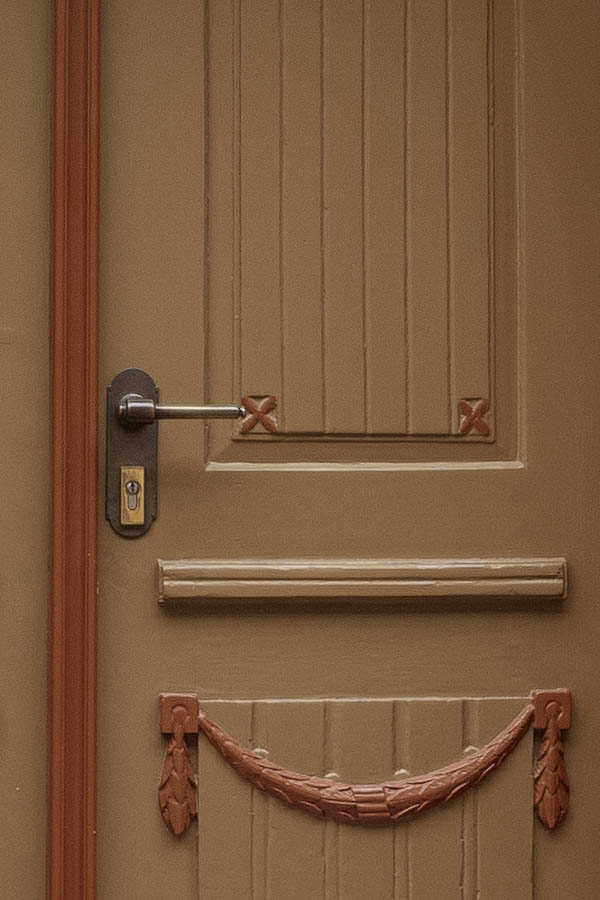 Photo 12354: Carved, panelled, brown and red double door with top window