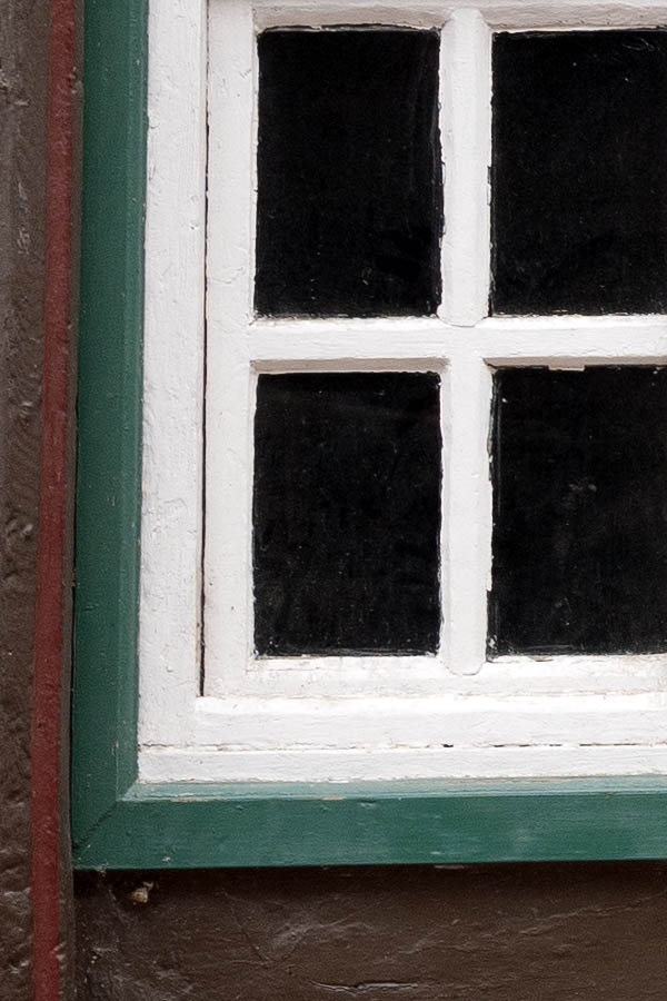 Photo 12384: Worn, green and white window with 32 panes