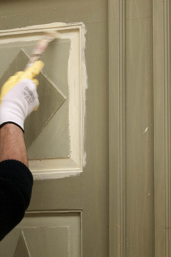 Photo 12518: Panelled, green, light green and light yellow double door under repair