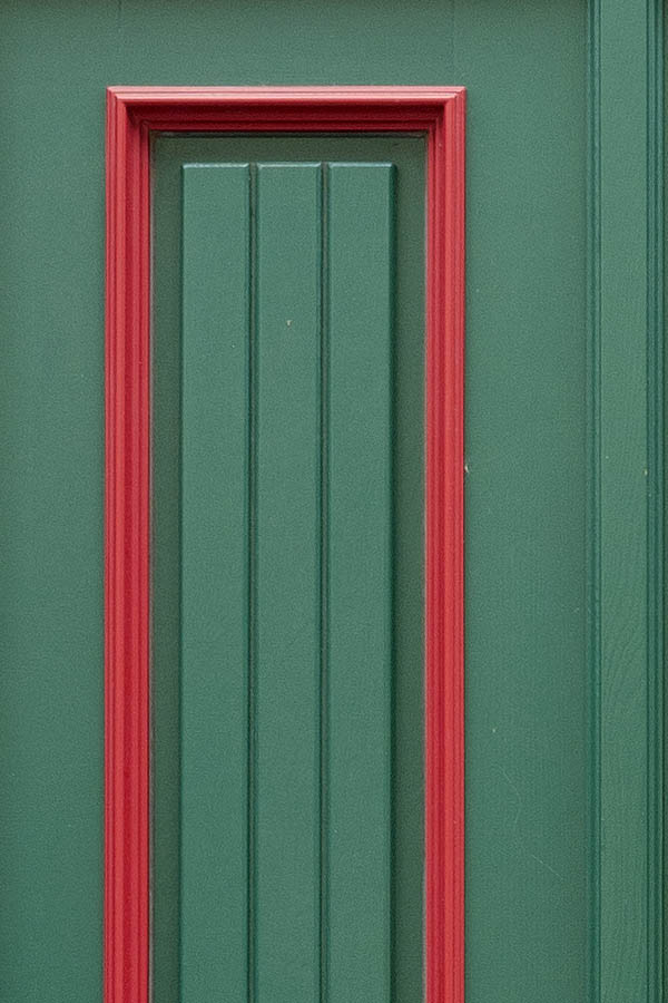 Photo 12575: Panelled, green and red door with sidepiece and top window