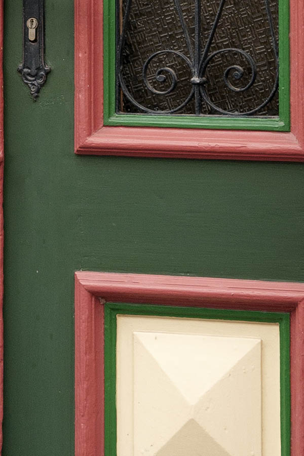 Photo 12671: Carved, panelled, pink, green and light yellow double door with formed door lights