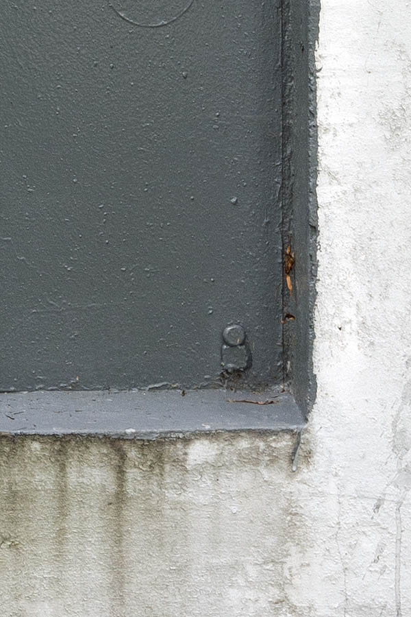 Photo 12772: No window. Grey embrasure in a white, roughcast wall.