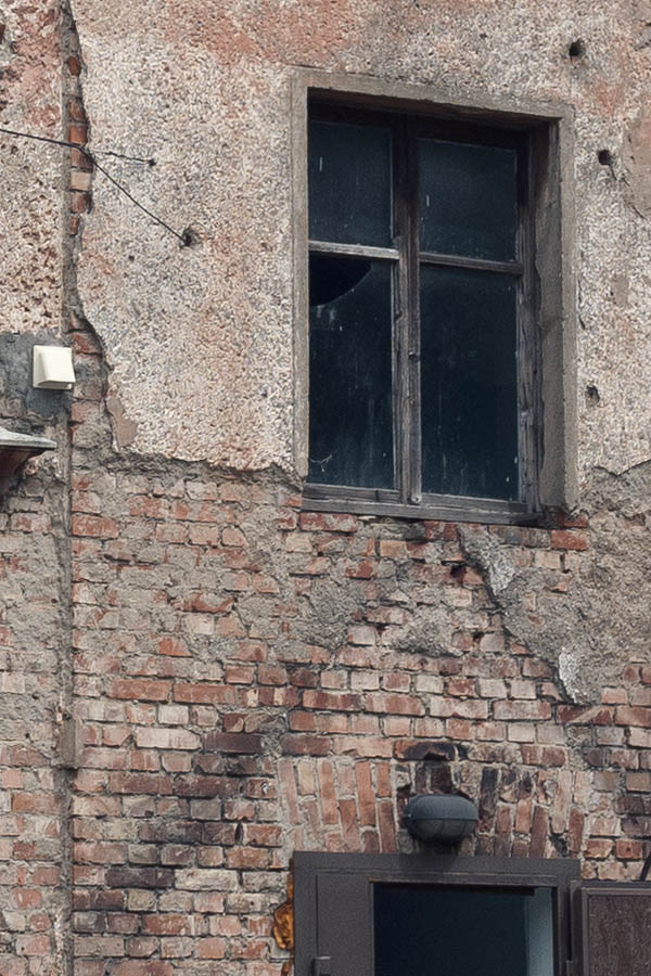 Photo 12795: Red and yellow facade with door and 10 windows