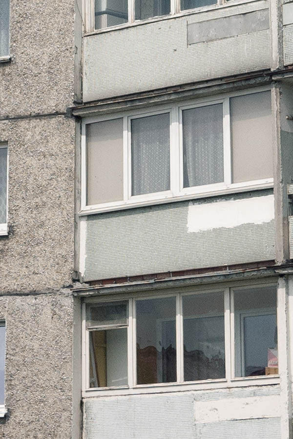 Photo 12874: Grey facade of a 10-storey house with balconies