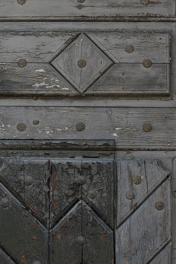 Photo 13028: Panelled, formed, unpainted gate with minor door