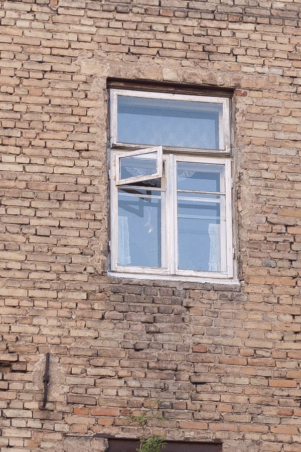 Photo 13048: Facade of yellow bricks with white windows