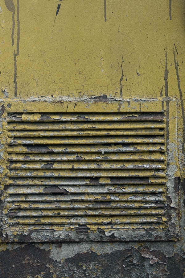 Photo 13267: Decayed, yellow metal plate double door with ventholes