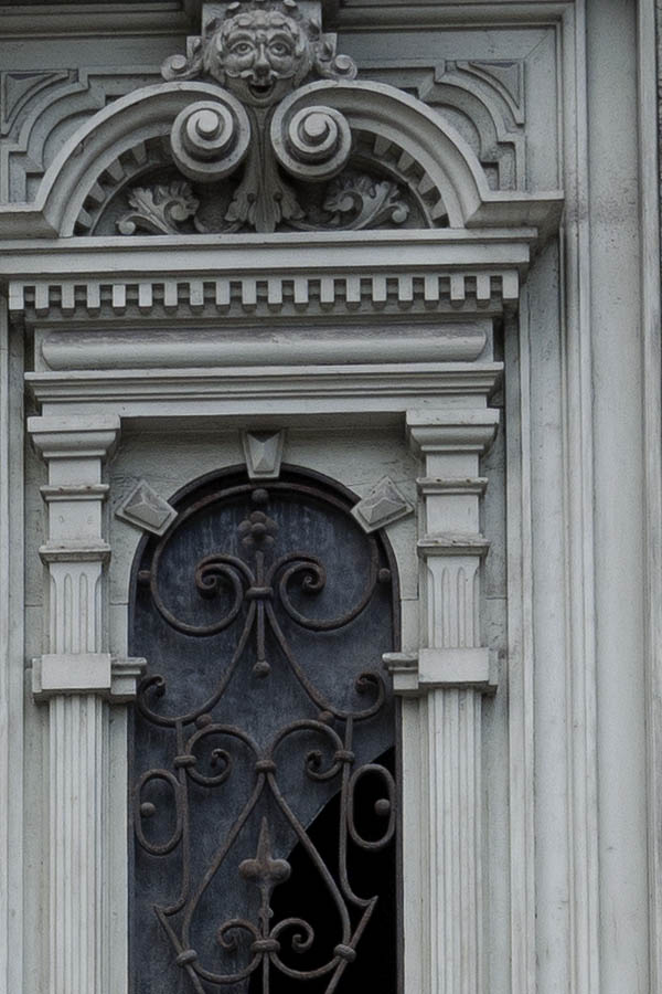 Photo 13298: Worn, carved, light grey double door with latticed door lights