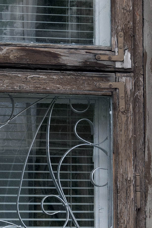Photo 13304: Worn, brown, unpainted window with three frames
