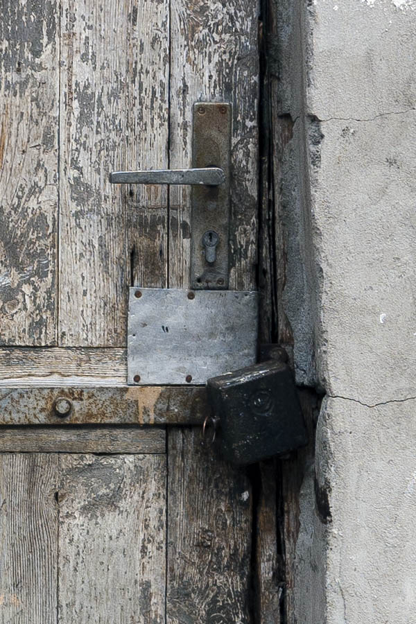 Photo 13396: Decayed, panelled, grey door