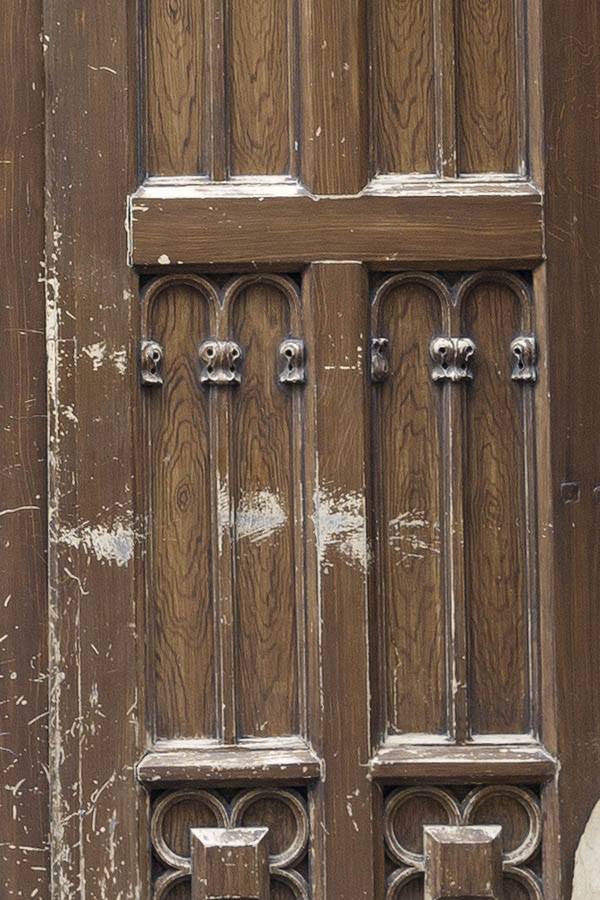 Photo 13619: Worn, carved, panelled, brown door with sidepieces and top window
