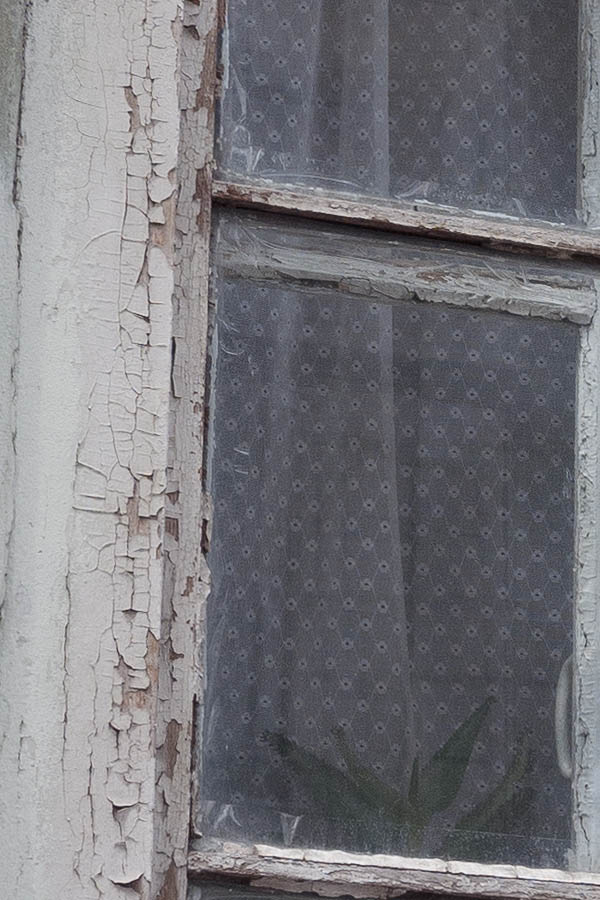 Photo 13833: Worn, formed, white window with four frames and eight panes