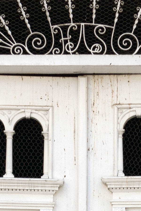 Photo 14499: Lopsided, carved, panelled, white gate with formed door lights and latticed, white fan light