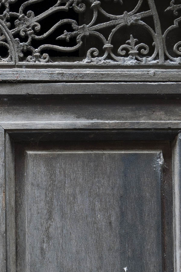 Photo 14680: Worn, panelled, grey and unpainted gate with latticed cast iron fan light