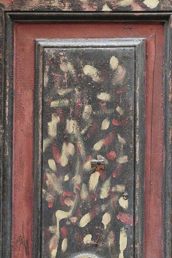 Photo 14752: Panelled, brown, yellow and red double door with barred fan light