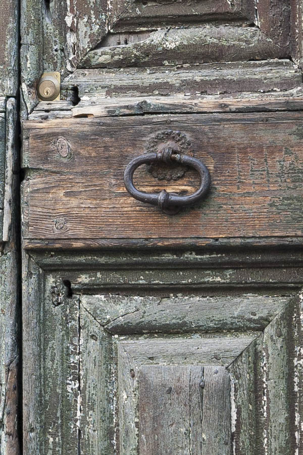 Photo 14840: Decayed, panelled, unpainted, light green double door with rusty, latticed fan light
