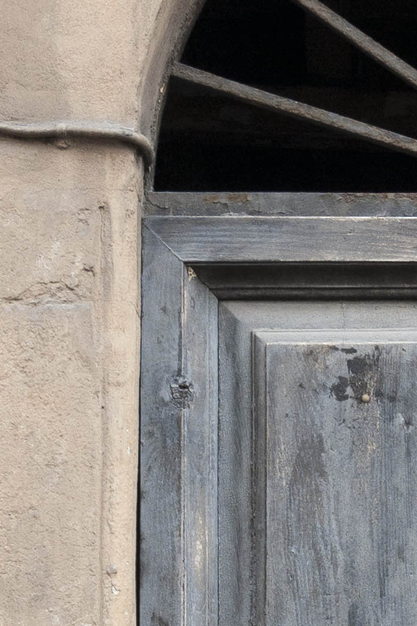 Photo 14949: Panelled, unpainted, grey double door with latticed fan light