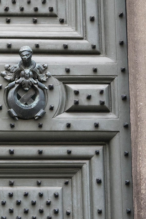 Photo 15011: Large, panelled, grey double door with fan light and many black nails