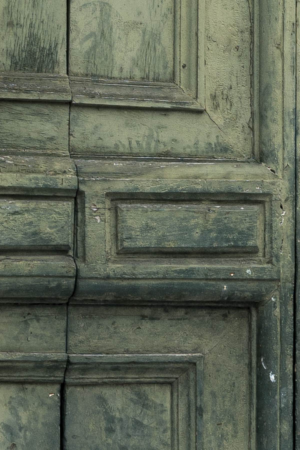 Photo 15038: Worn, panelled, green gate with minor doors