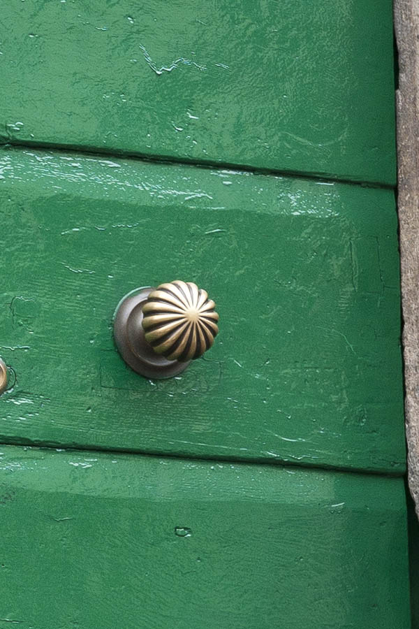 Photo 15218: Green double door made of planks with barred, white fan light